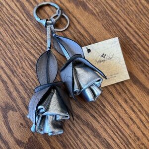 Patricia Nash Keychain/ purse tassel. Leather Rose color is antique platinum NWT